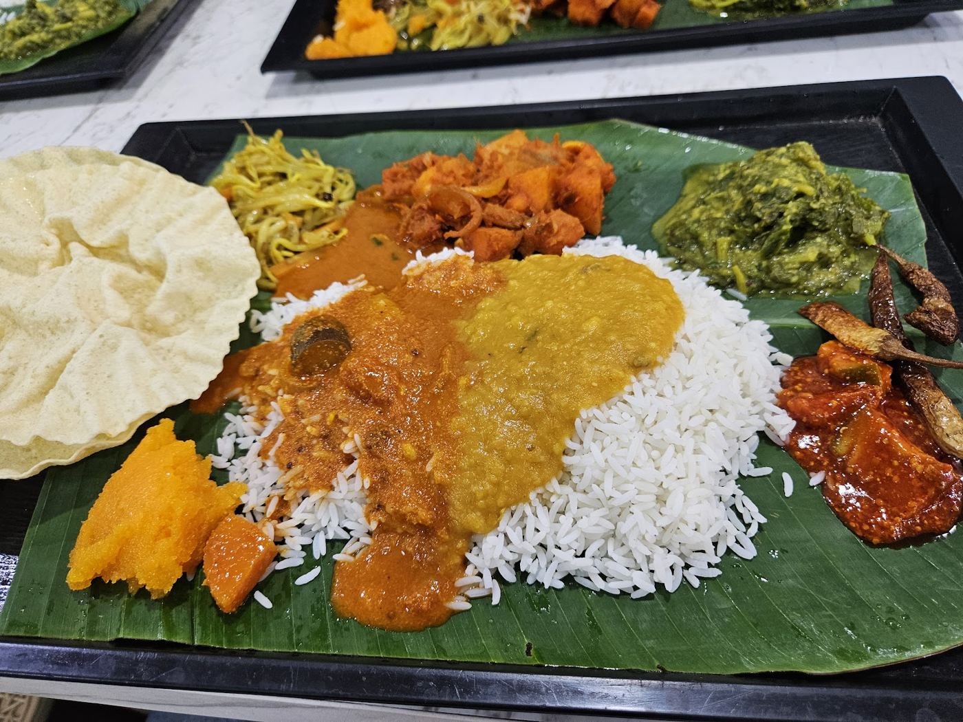 Banana leaf rice set with papadam